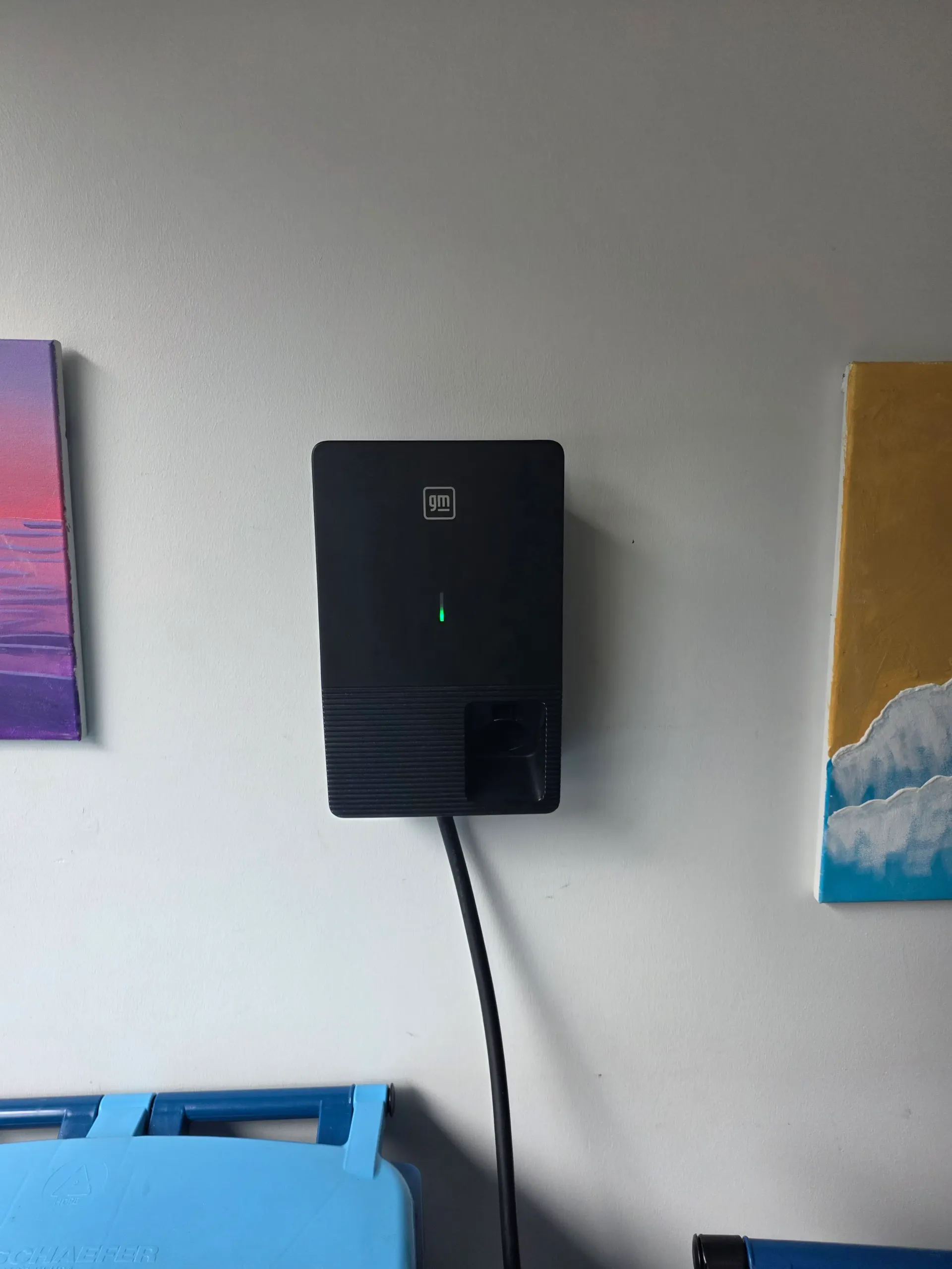 GM charger installed on a residential wall