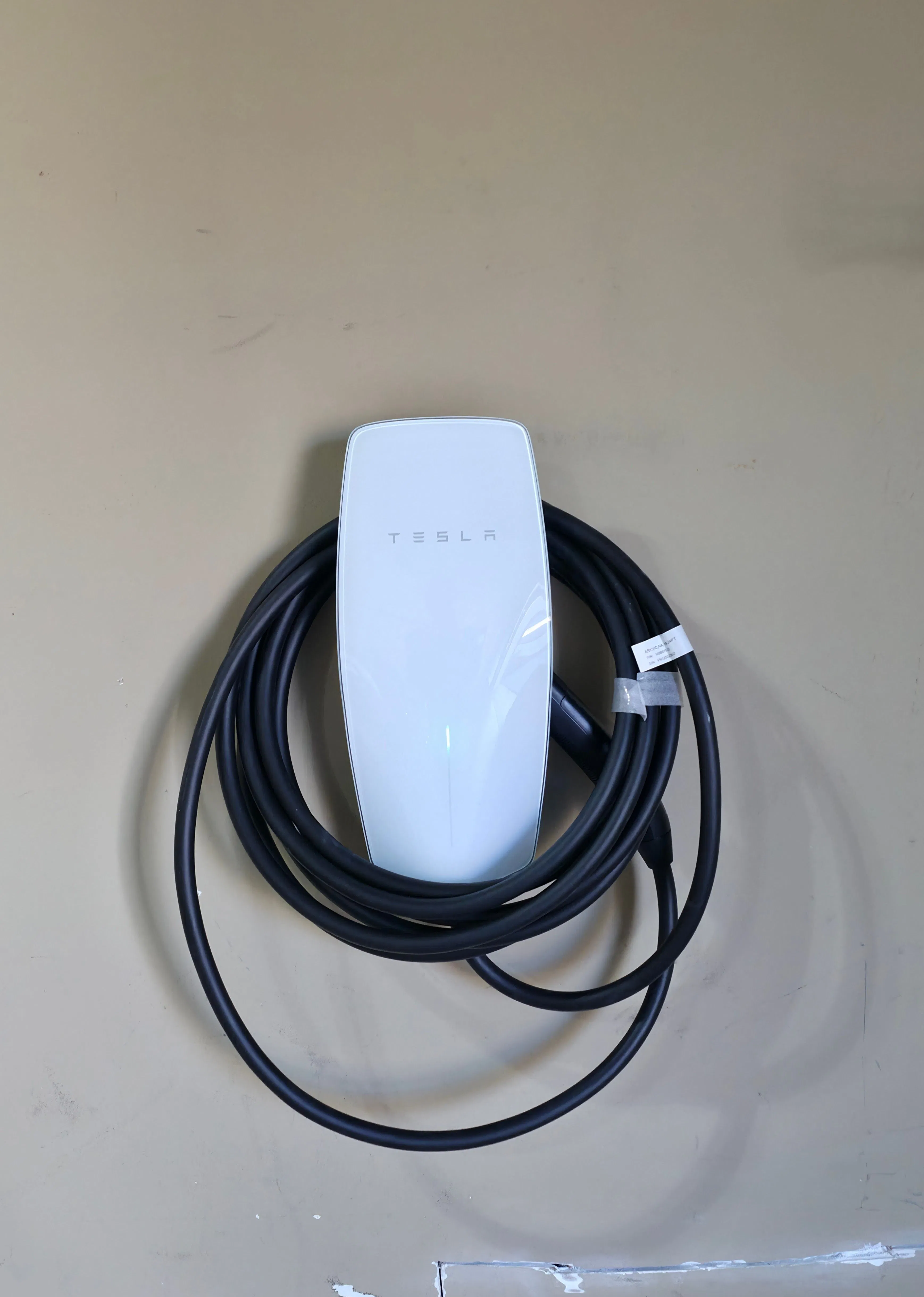 Clean wall-mounted universal Tesla Wall Connector installation in Ashburn, Virginia